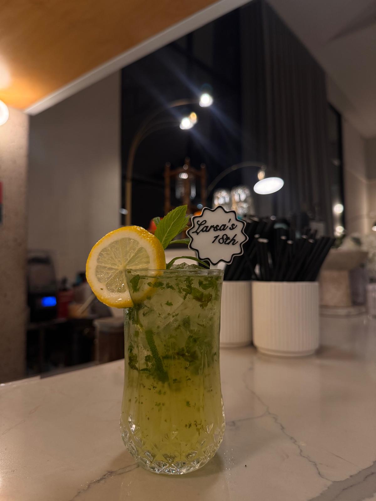 Personalised birthday drink stirrer in a cocktail