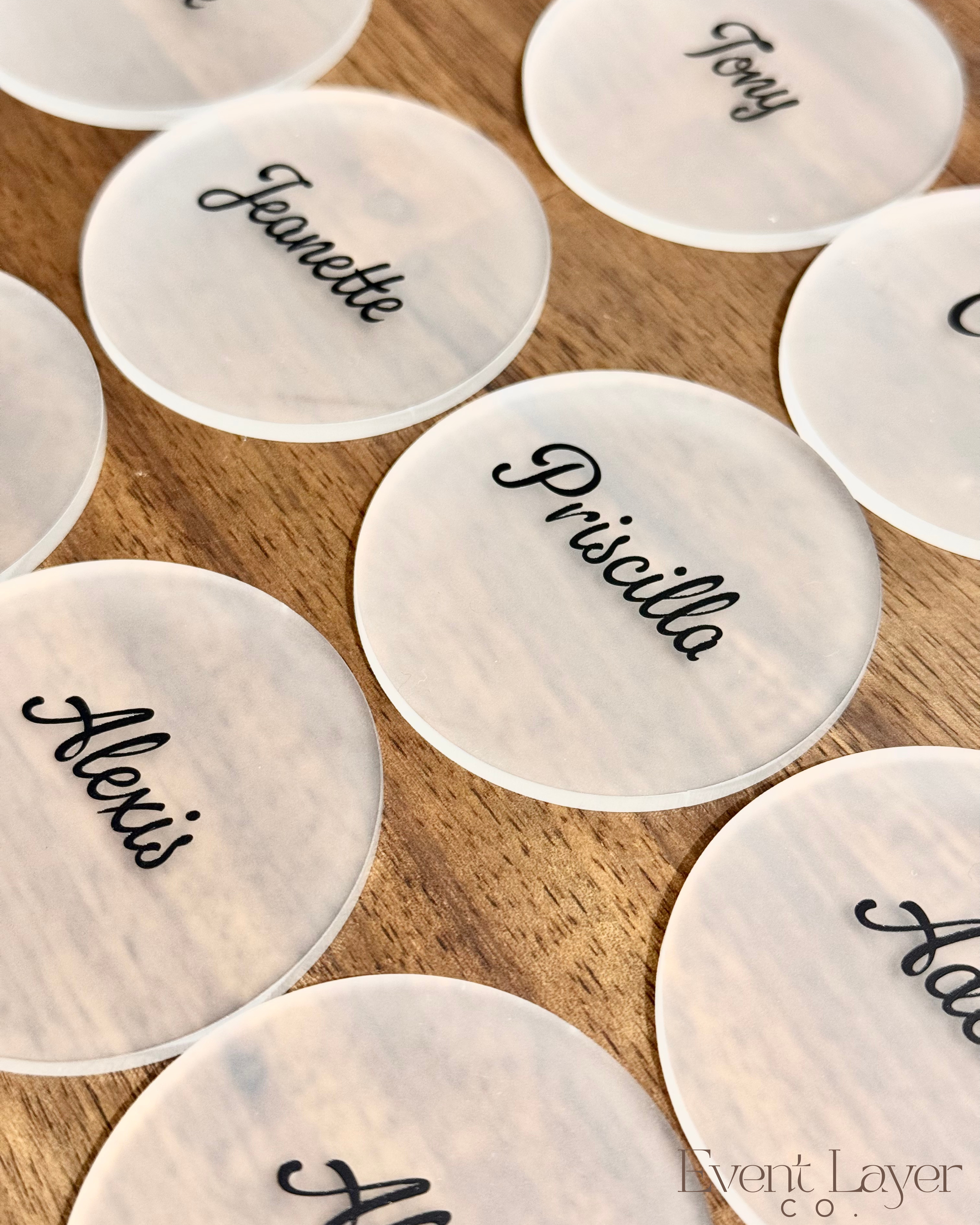 Frosted round place names with black script lettering